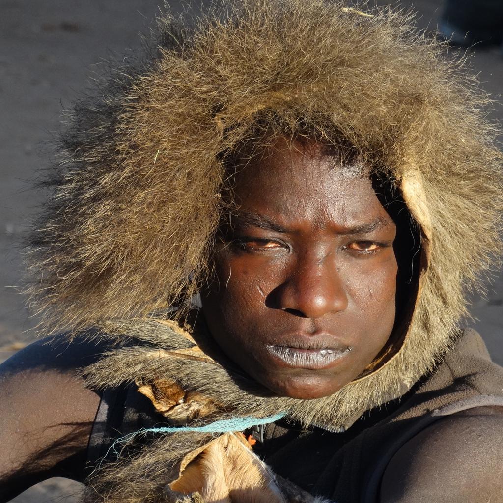 hadzabe man in tanzania with a cap made with fur