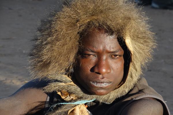 hadzabe man in tanzania with a cap made with fur