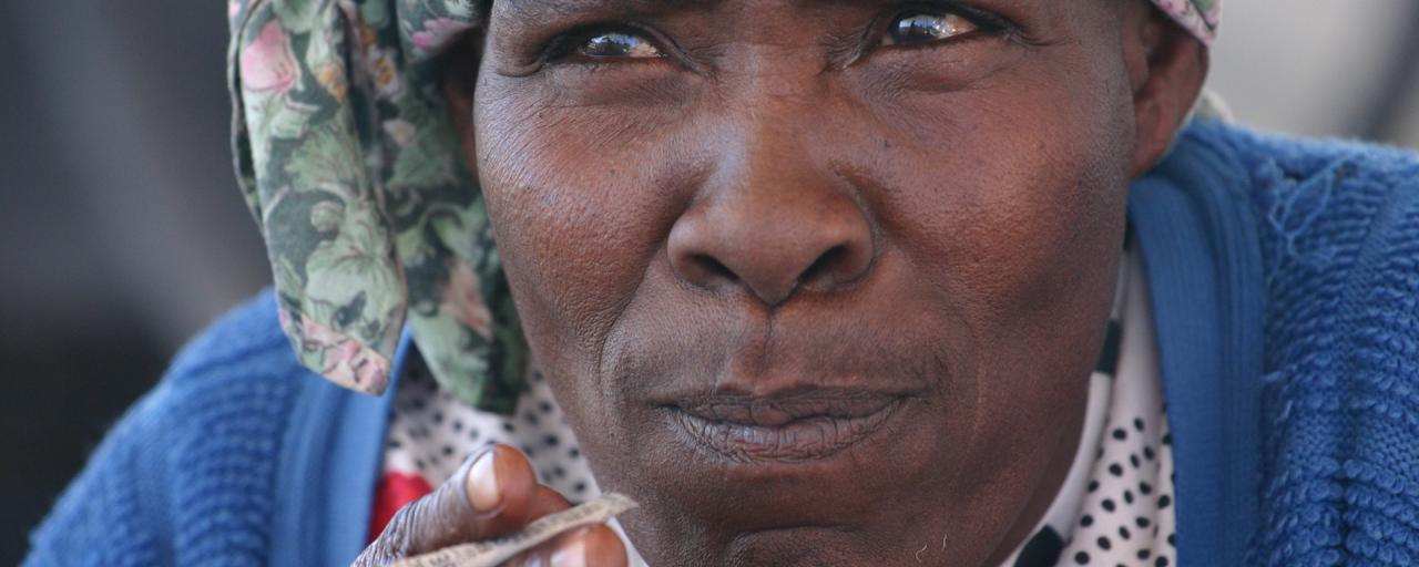 nama woman smoking in kalahari desert