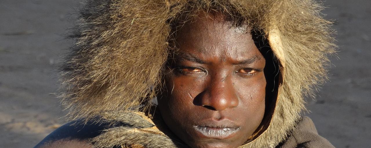 hadzabe man in tanzania with a cap made with fur