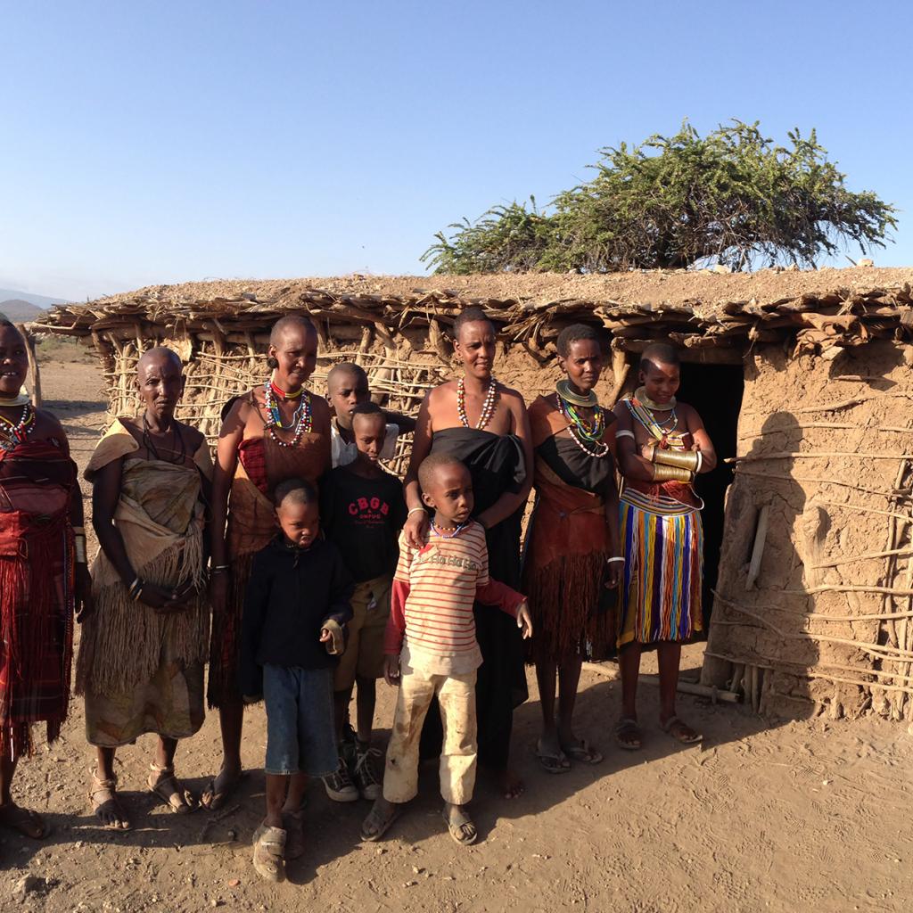 datoga people in front of their huts in tanzania